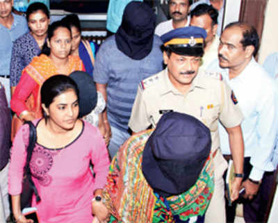 Wife, sister-in-law held for banker’s murder
