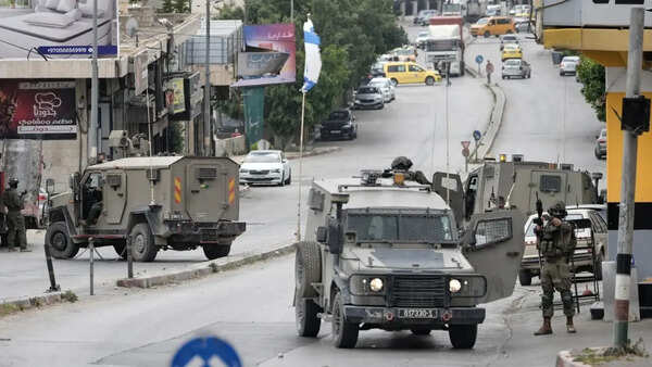 Israel's military said a Palestinian family could bury their father. Then the settlers arrived