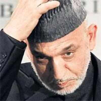 Karzai threatens to join Taliban