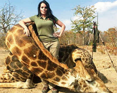 Defiant US hunter’s picture with dead giraffe stirs outrage