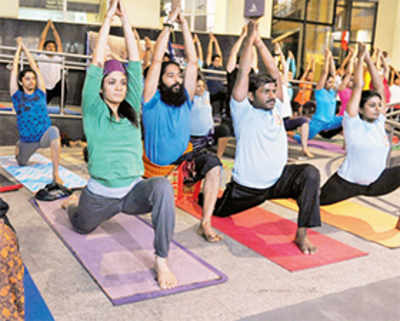 Ministers vie to bend it like Modi on Yoga Day