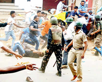 One dead as mob caned to avert clash over Tipu