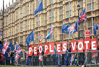 Brexit in turmoil as May postpones crucial vote