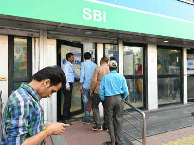 SBI halves ATM withdrawal limit to Rs 20,000