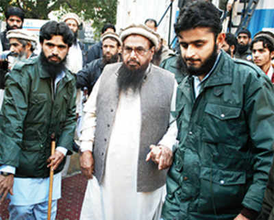 Pak bans JuD, Haqqani Network; slaps travel restrictions on Saeed