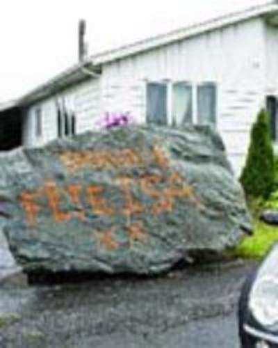 Man dumps boulder on ex-wife's driveway