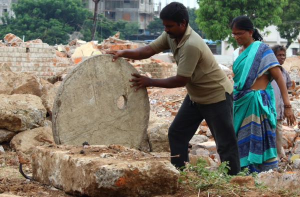 They scour through rubble in search of building blocks