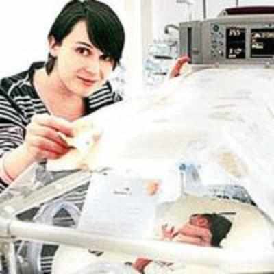 Woman lies upside down for 75 days to save twins