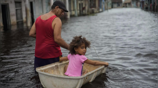 Man guides his granddaughter