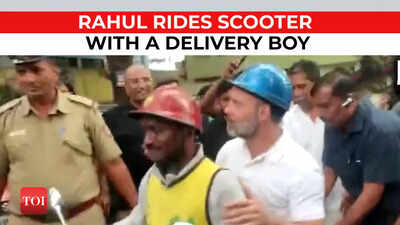 Congress leader Rahul Gandhi rides scooter with a delivery boy in Bengaluru