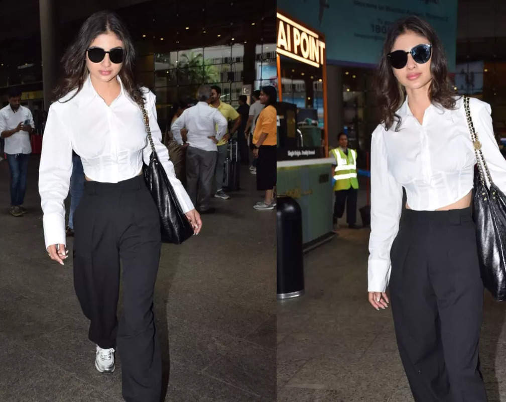 
Mouni Roy looks elegant in a simple white shirt with black pants. CHECK OUT!
