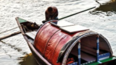 Boatmen on the Hooghly now sailing on solar power