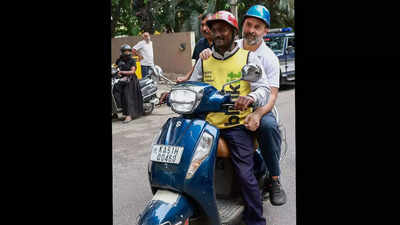 Rahul Gandhi rides pillion on scooter of delivery boy in Bengaluru
