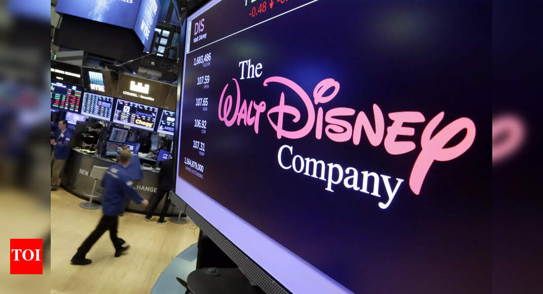 Wall Street edges lower following inflation data, drops for Disney, banks – Times of India