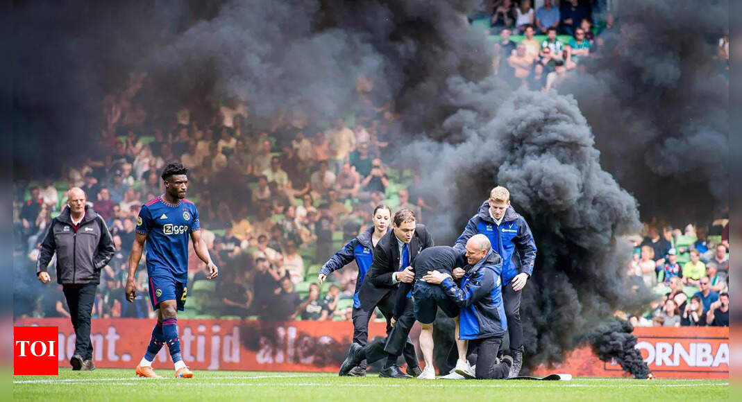 Dutch game abandoned after nine minutes as smoke bombs thrown ...