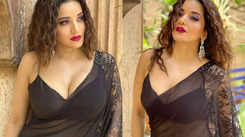 Monalisa wows everyone with her bewitching look as she poses in a black transparent saree