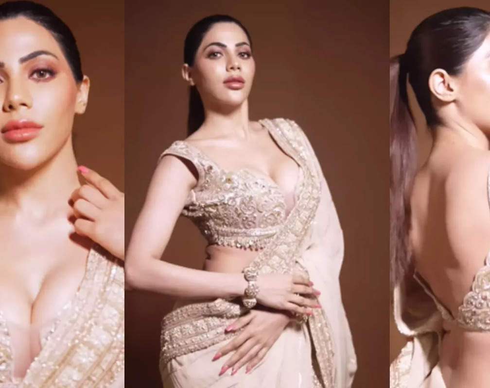 
Nikki Tamboli says, 'I’m not your cup of tea; I’m champagne' as she flaunts her curves in a saree
