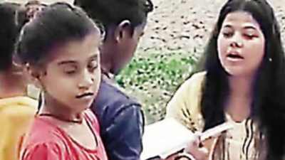 Young graduate imparting basic edu to slum kids