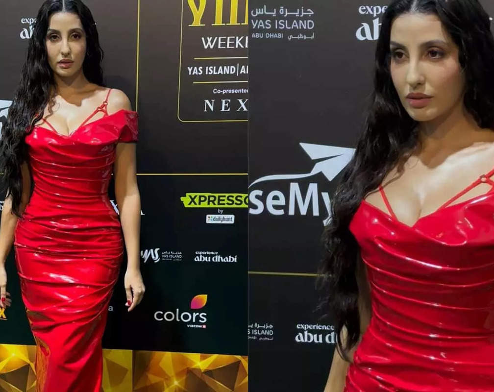 
Nora Fatehi stuns in red latex outfit with a plunging neckline, ditches accessories
