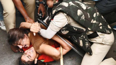 Wrestlers try to march to Parliament, held; Delhi cops book stir 'organisers'