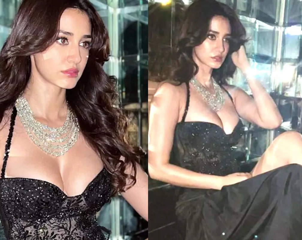 
Disha Patani flaunts her curves in black corset top and a thigh-high slit skirt; Mouni Roy calls her, 'Belle of the ball'
