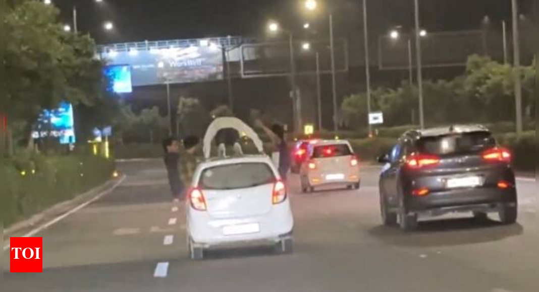 Man gets fined for doing push-ups on a moving car - Times of India