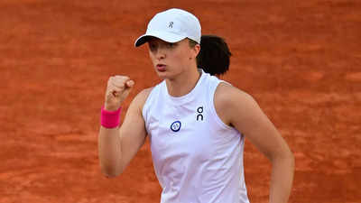 Defending champion Iga Swiatek sets up French Open last eight with Coco Gauff