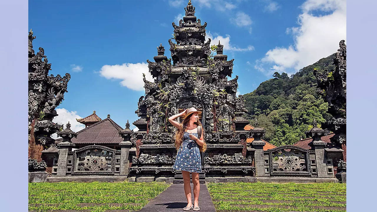 Dress appropriately, don't climb volcanoes: Bali's new rules for