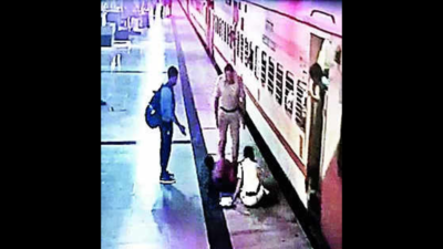 RPF constable saves woman from slipping under moving train