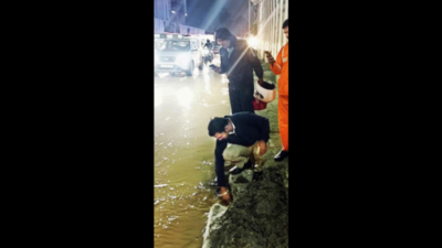 Cops in Bengaluru clean drain to ease Whitefield's rain woes