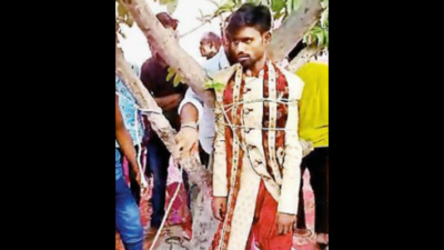 Jaimala: UP: Groom tied to tree for asking bride to wear goggles at ...