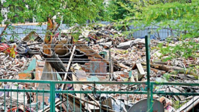 Slum demolished near Vasant Vihar, those left on streets wave documents