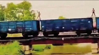 Two record reel on top of a moving train, held