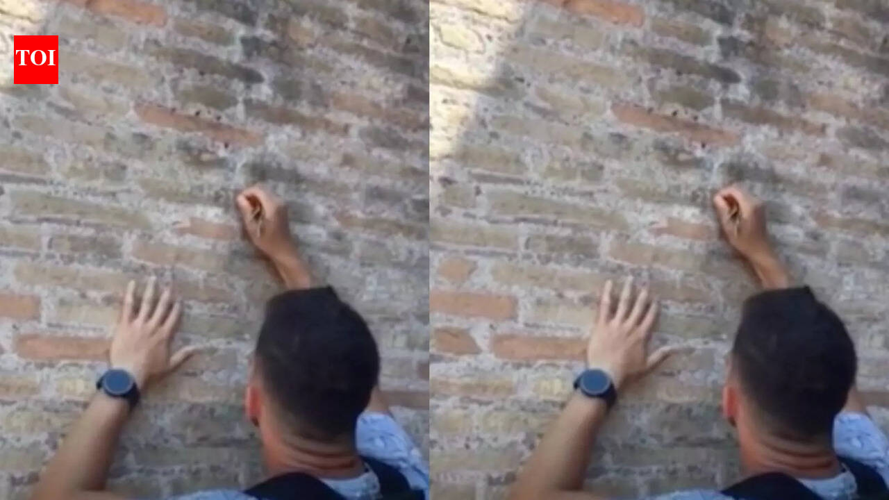 Tourist catches man defacing Rome Colosseum
