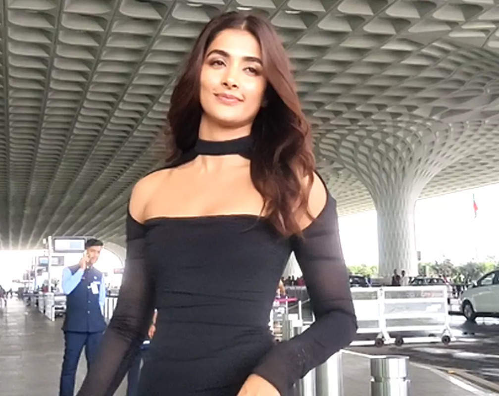
Pooja Hegde makes heads turn at airport in a black bodycon dress
