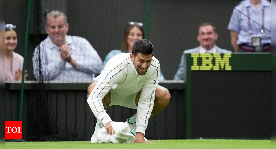 Watch: Novak Djokovic helps dry damp Wimbledon court amid rain delay | Tennis News