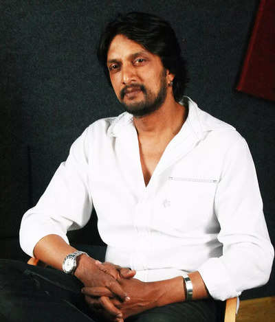 Kannada film producer MN Kumar accuses Kichcha Sudeep of evading him after taking remuneration for a film for 8 years; claims it has caused him to be neck-deep in debt