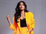 Chitrangda Singh nails boardroom fashion in chic tangerine pantsuit