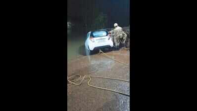 2 escape unhurt as car goes off ramp into river | Goa News - Times of India