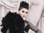 Urvashi Rautela commands attention at PFW in black net dress with dramatic feather sleeve