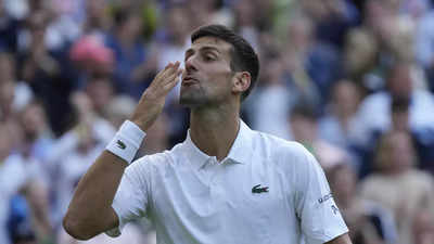 Novak Djokovic celebrates 350th Grand Slam win as climate protesters disrupt rain-hit Wimbledon