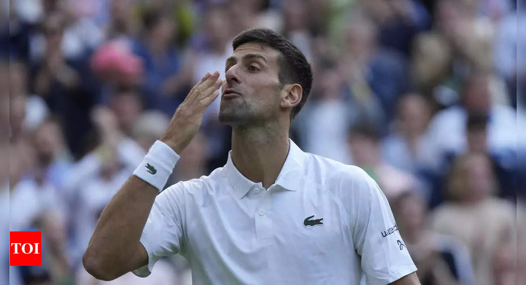 Novak Djokovic celebrates 350th Grand Slam win as climate protesters disrupt rain-hit Wimbledon | Tennis News – Times of India