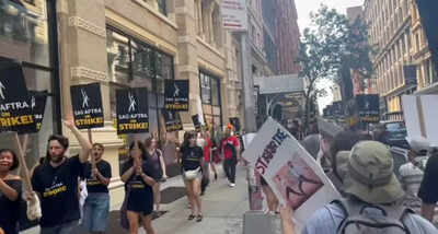 Picture of a man holding ‘RRR’ poster during Hollywood actors' strike