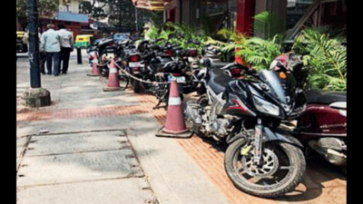 Bengaluru cops turn gaze on motorists using footpaths for parking