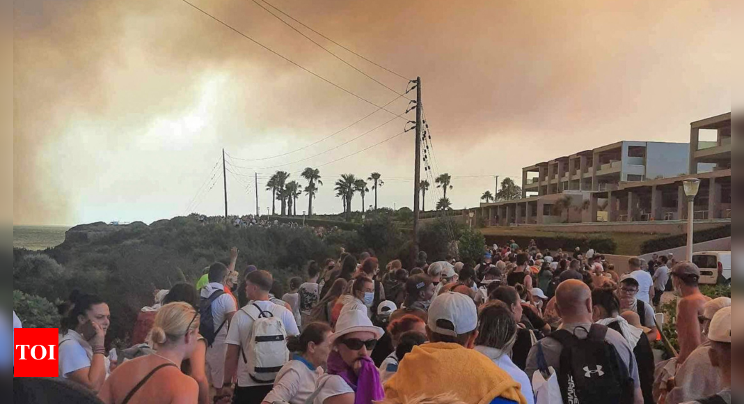Rhodes: Greek authorities evacuate some 19,000 people as wildfire blazes on the island of Rhodes – Times of India