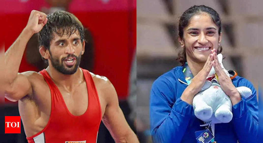 Vinesh Phogat, Bajrang Punia could be withdrawn from Asian Games squad if they lose Worlds trials: IOA’s ad-hoc panel member | More sports News – Times of India