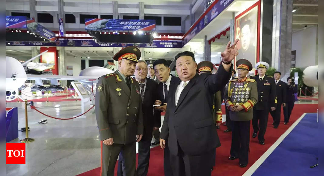 Kim Jong Un North Korea Shows Off Ballistic Missiles Drones At Night Time Parade Times Of India