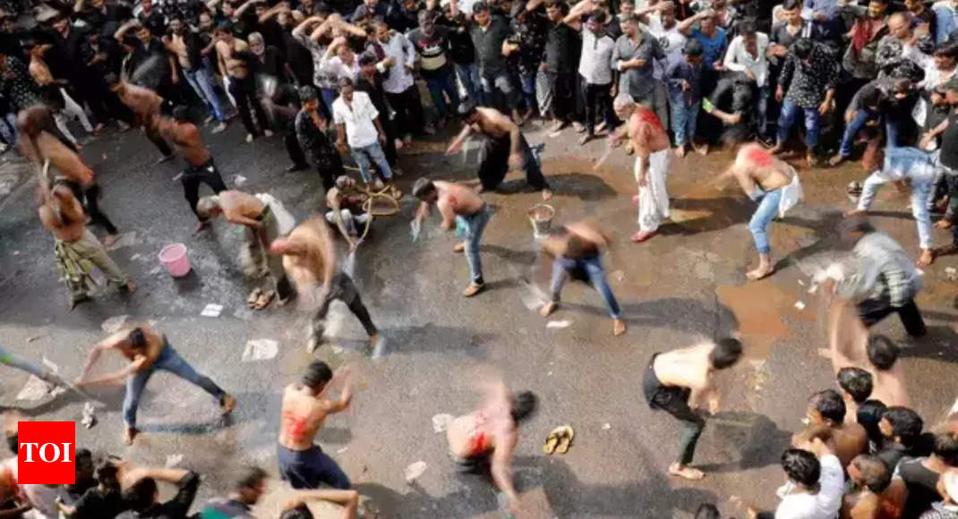 A young Muslim boy displays his stick-fighting skills during a procession  to mark Ashoura in New Delhi, India, Saturday, July, 29, 2023. Ashoura is  the tenth day of Muharram, the first month