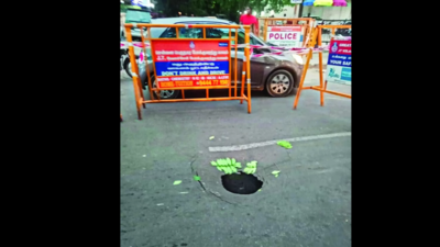 Crater on road after sewer line breaks