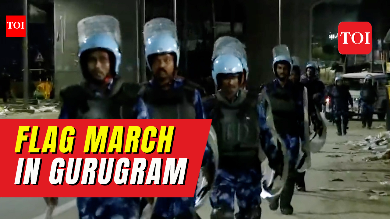Gurugram communal violence: Rapid Action Force conducts flag march in ...
